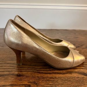 Kenneth Cole Reaction pumps with a gold shimmer.